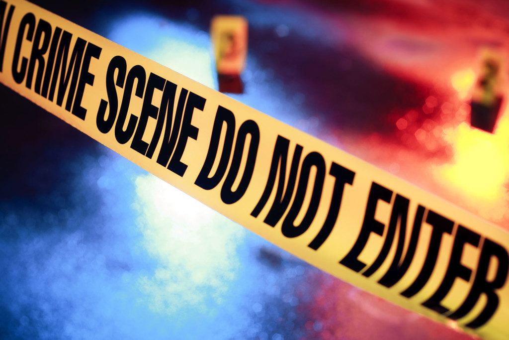 Yellow crime scene tape marking off restricted cleanup area